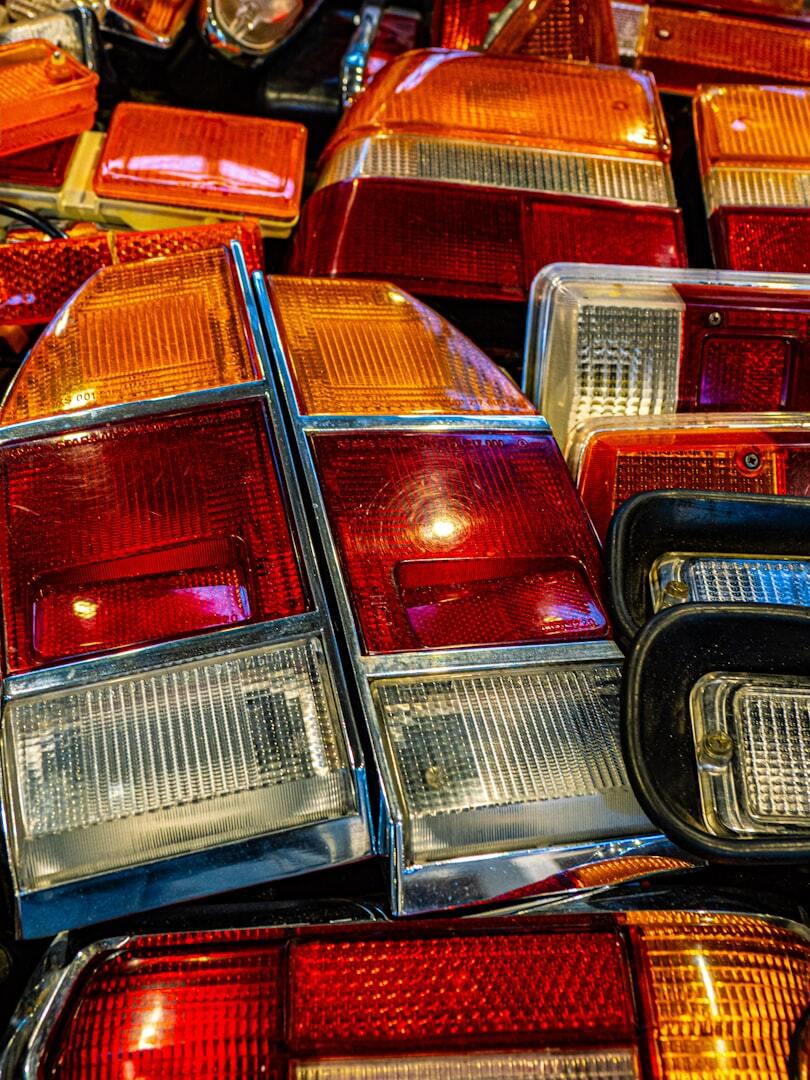 Car taillights of various sizes and styles are visible. Car taillights of various sizes and styles are visible.