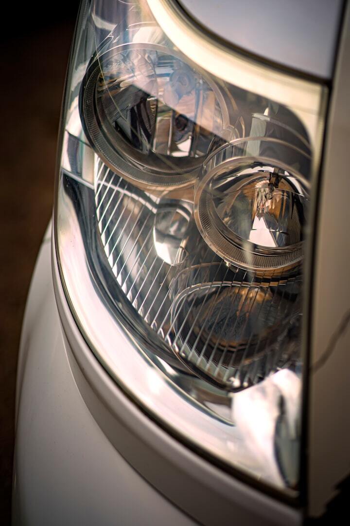 close up photo of car headlight close up photo of car headlight