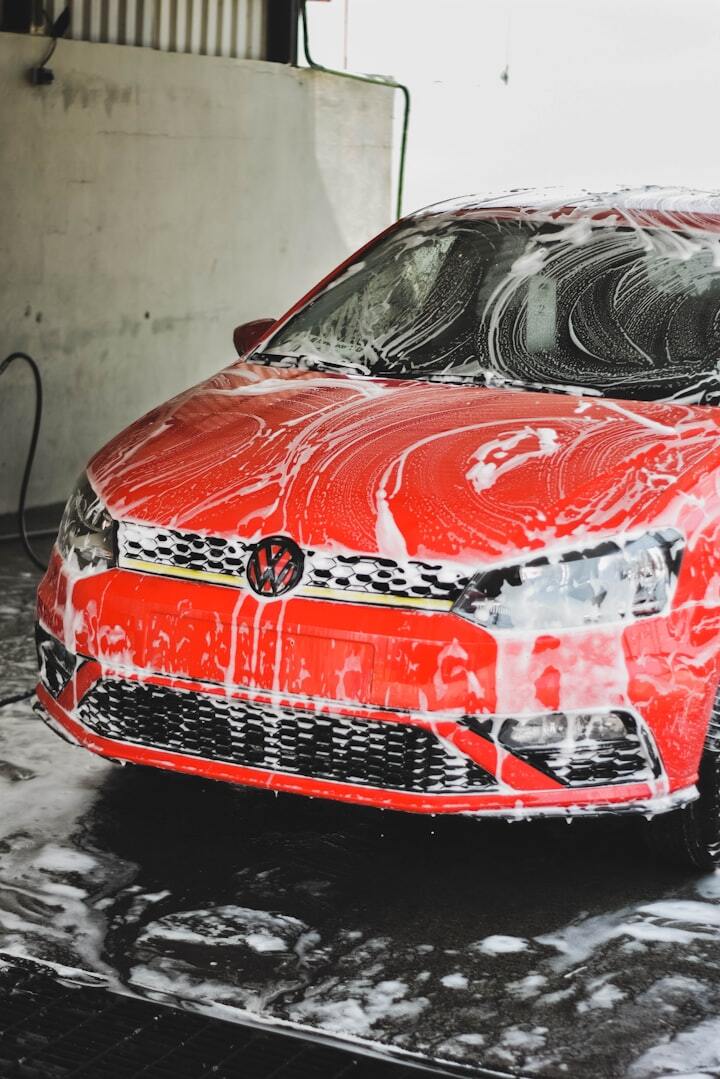 a red car is covered in a lot of snow a red car is covered in a lot of snow